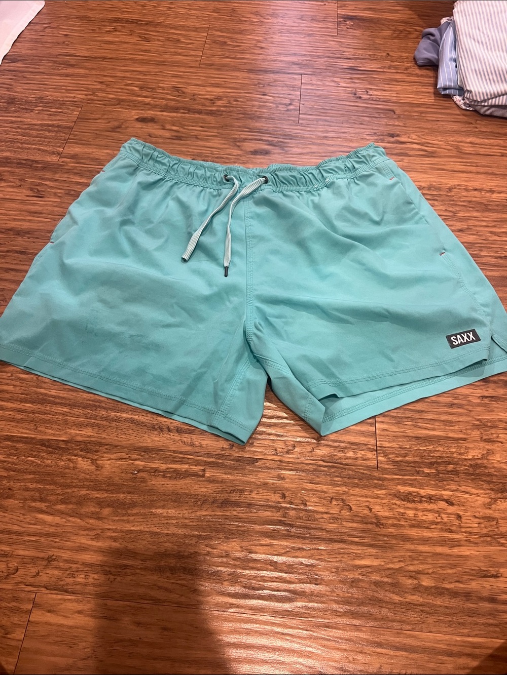 Saxx Men's Teal Swim Trunks
OH BUOY 2N1
Size: XL